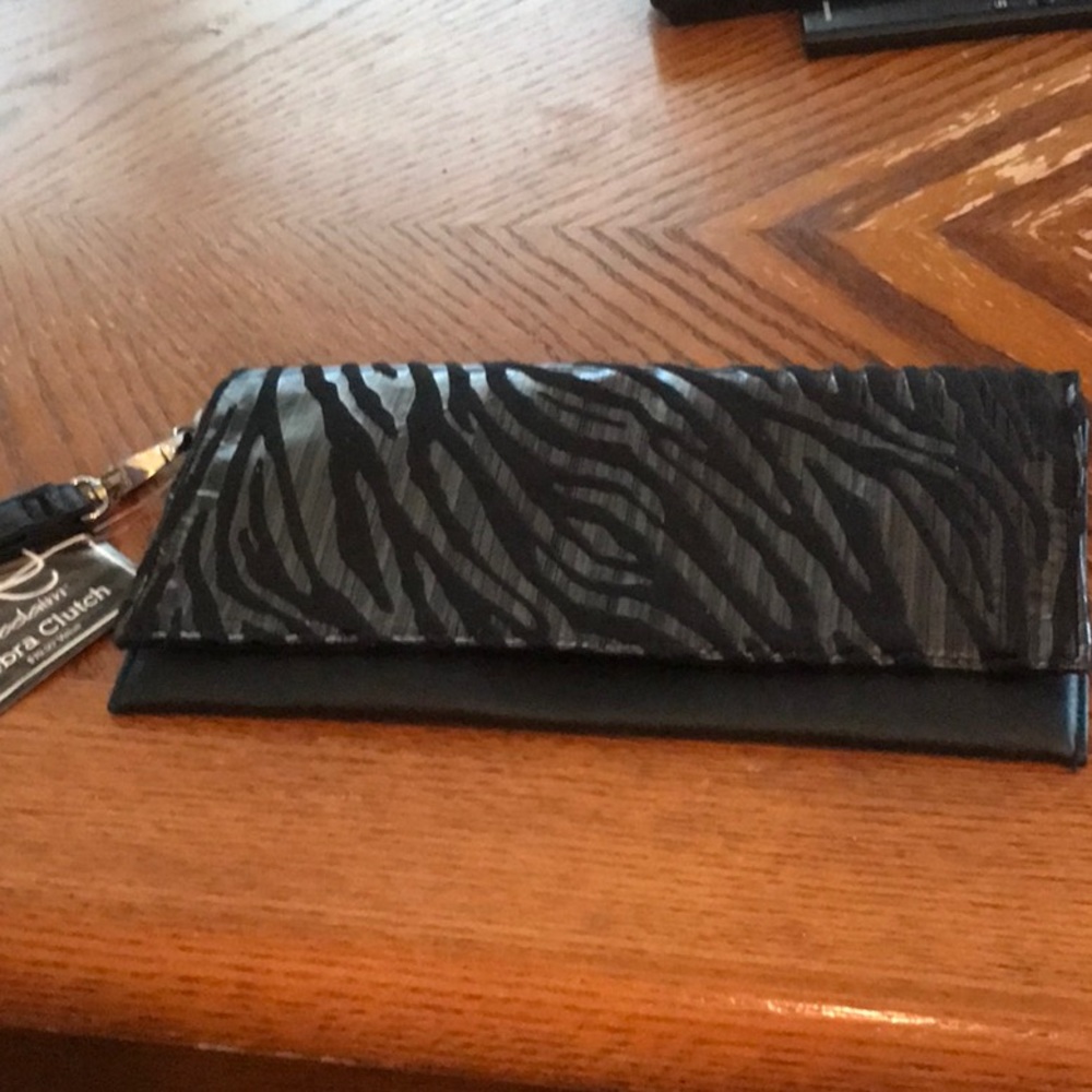 New Proclaim Zebra clutch gold and black